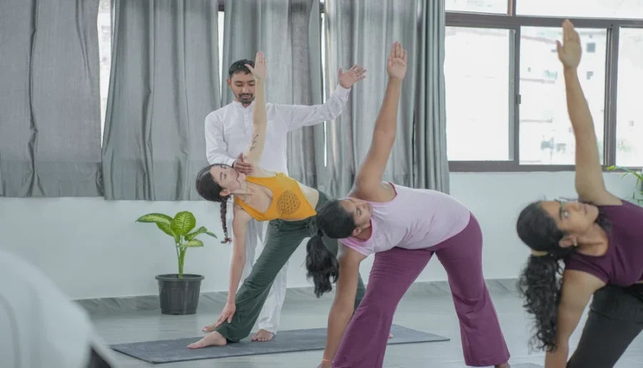 Who typically enrols in a yoga teacher training program?