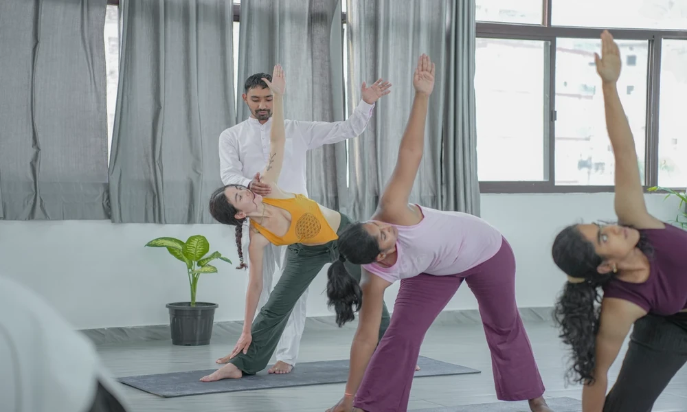 Who typically enrols in a yoga teacher training program?